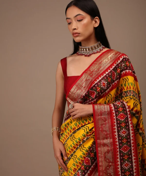Chrome Yellow Saree In Silk With Multi Colored Patola And Foil Print And Contrasting Maroon Border